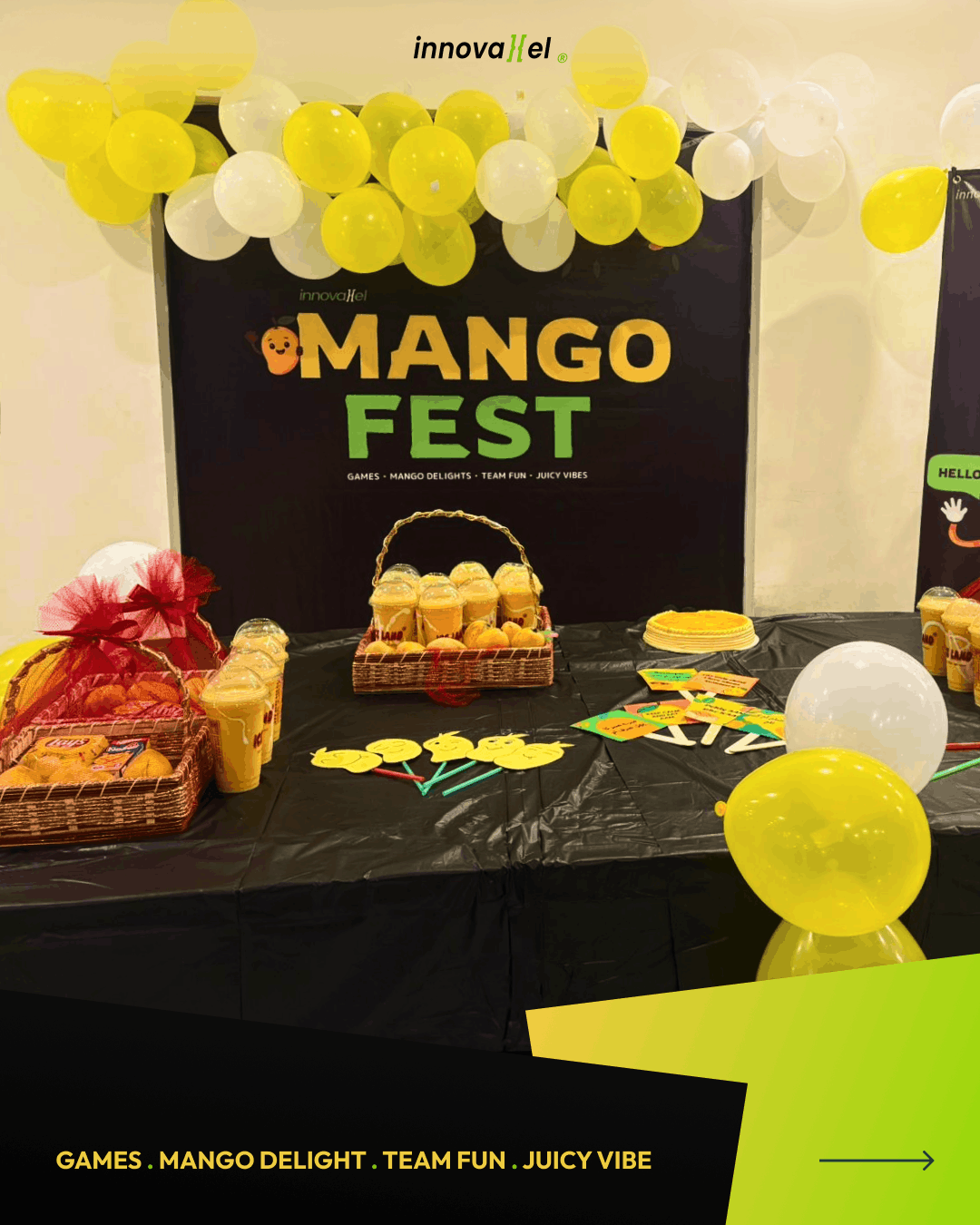 Mango Fest table spread with mango juices, snacks, and balloon decorations